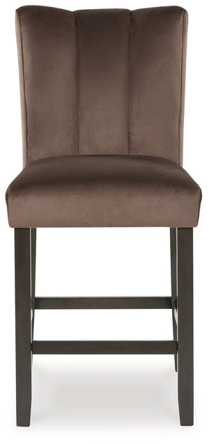 Set of two Jeshina upholstered barstools by Signature Design by Ashley in mocha with cushioned seats and wooden legs.