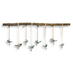 Light brown birds on a branch wall art by Uttermost, showcasing detailed bird and branch design for elegant wall decor.