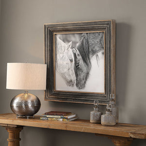 Framed black and white horse print with dark brown border by Uttermost, showcasing detailed horse artwork in a stylish display.