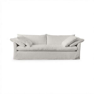 Classic Home Cassiano slip cover sofa in a neutral fabric, showcasing a stylish stationary sofa design with plush cushions.