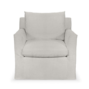 Classic Home Cassiano swivel chair with padded upholstery and wooden base, shown in a cozy living room setting.