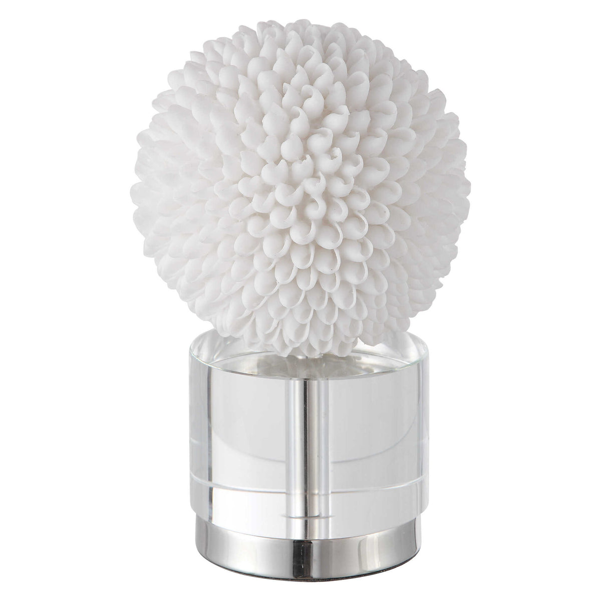 White Cascara sculpture by Uttermost, featuring an elegant abstract figurine with smooth curves on a textured base.