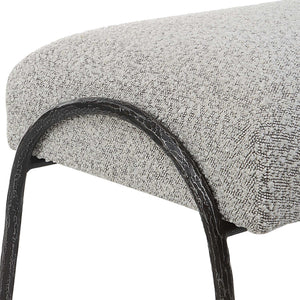 Gray upholstered Jacobsen modern bench by Uttermost with sleek, contemporary design and cushioned seating.