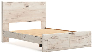 Signature Design by Ashley Lawroy panel bed with built-in storage drawers in a modern bedroom setting.