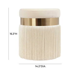TOV Furniture Melody tasseled upholstered ottoman with fabric covering and decorative tassels, serving as a stylish footrest or accent piece.