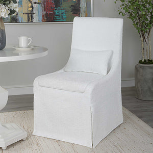 Uttermost Coley armless side chair with upholstered seat and wooden legs, modern design for living or dining spaces.
