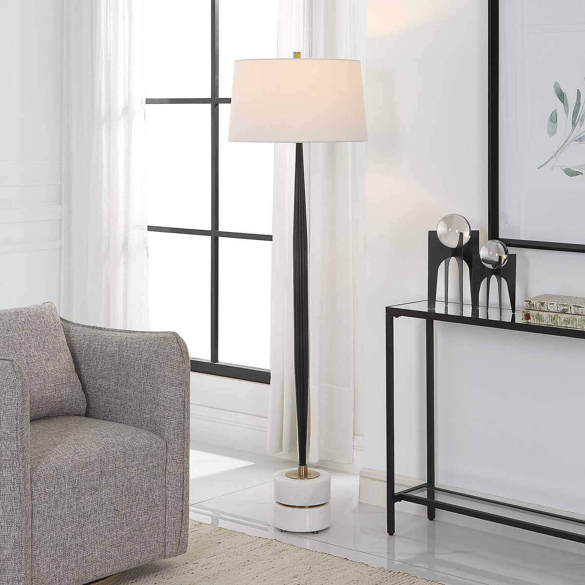 Uttermost Miraz black floor lamp with a sleek, modern design and a tall standing base, ideal for contemporary living spaces.