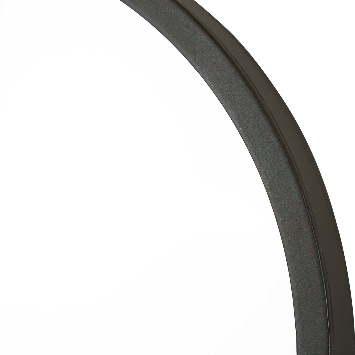 Uttermost Taft wall mirror with a sleek, modern frame, reflecting a stylish interior design.