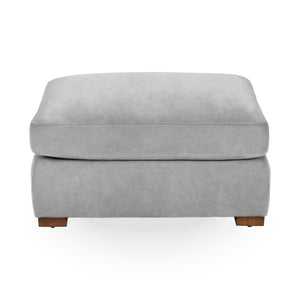 Classic Home Audrey upholstered ottoman with plush fabric and rounded design, ideal for living room decor.