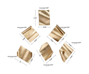 Set of six gold fluttering pages wall decor by Uttermost, stylish metal wall art with a dynamic, airy design for modern interiors.