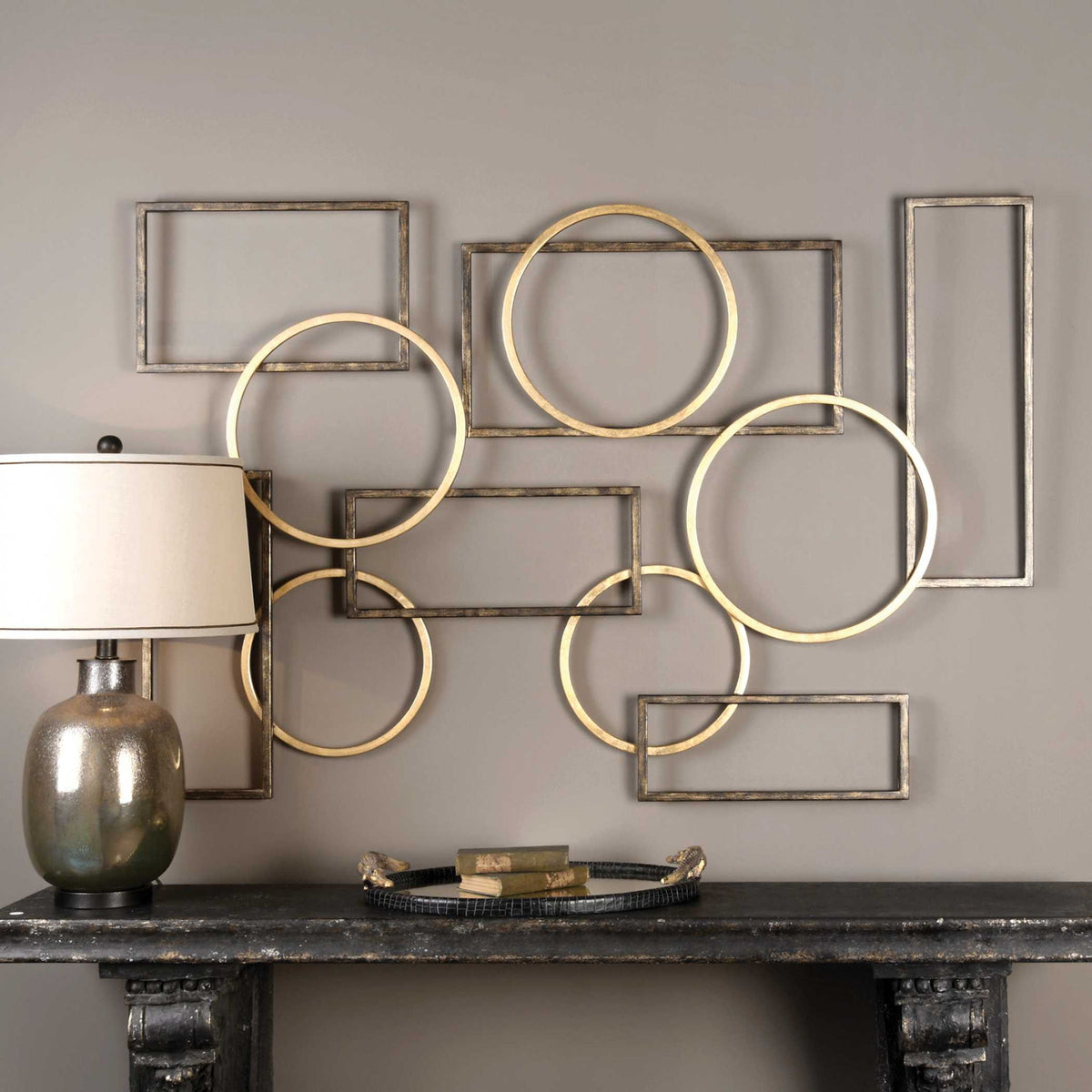 Elias wall art by Uttermost featuring bronze and gold tones, decorative metal wall decor with abstract design.
