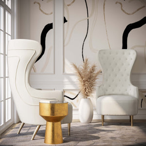 TOV Furniture Jezebel velvet wingback chair with high back and plush upholstery, elegant winged sides, in a stylish room setting.