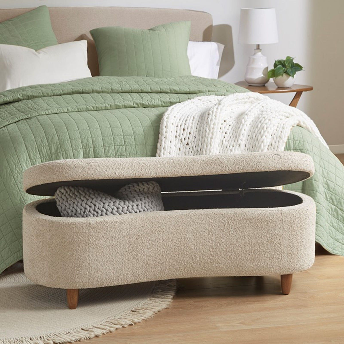 JLA Bailey flip top taupe storage bench with cushioned seat and wood legs, ideal for living room or entryway storage.