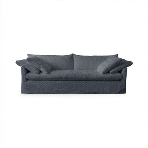 Classic Home Cassiano slip cover sofa with plush cushions and neutral fabric, showcasing a stylish stationary sofa design.