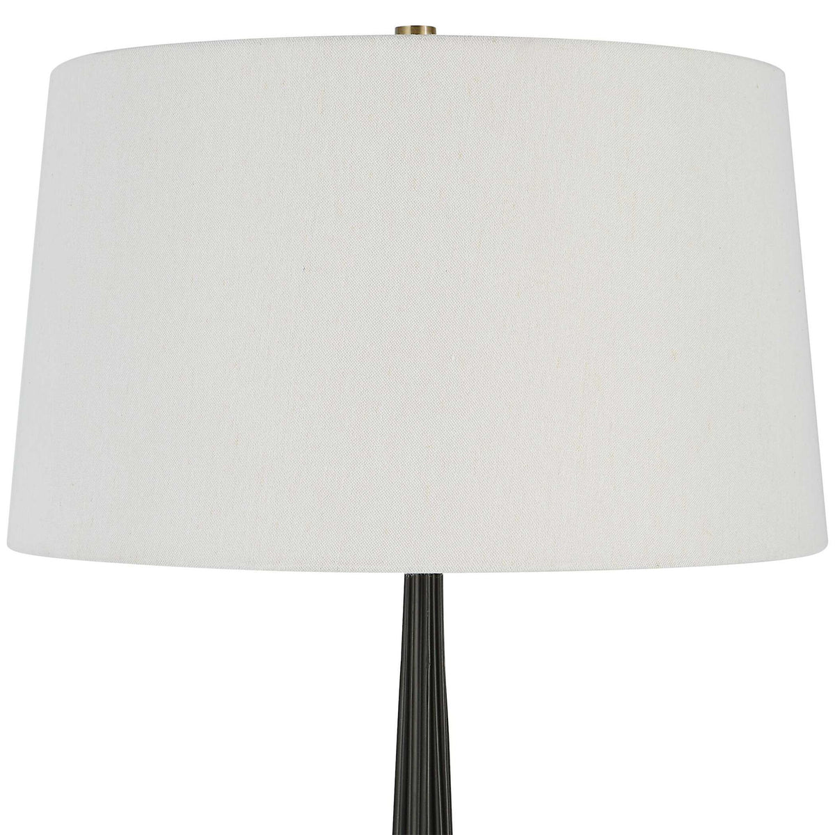 Uttermost Miraz black floor lamp with sleek modern design, standing tall with a round base and a slim, elegant pole.