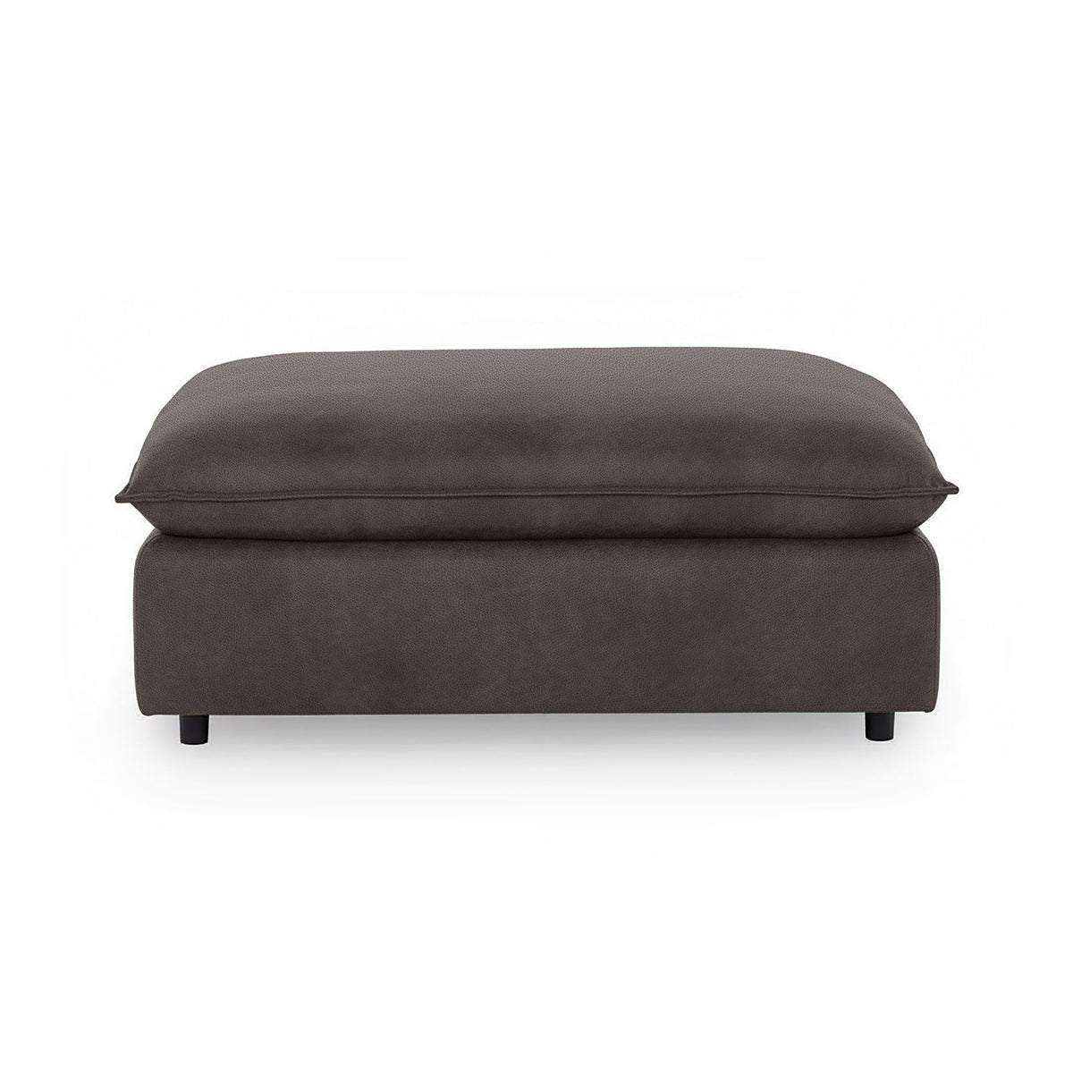 Classic Home Caplan upholstered ottoman with a plush fabric surface and wooden legs, perfect as a footrest or accent piece.