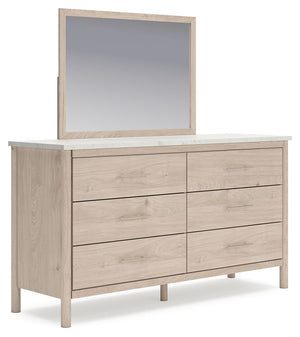 Signature Design by Ashley six-drawer dresser with a sleek wood finish and modern hardware, ideal for bedroom storage.