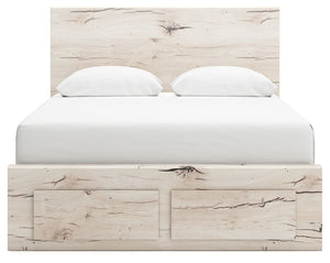 Signature Design by Ashley Lawroy panel bed with built-in storage drawers in a modern bedroom setting.