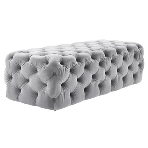 TOV Furniture Kaylee velvet ottoman with plush upholstered surface and modern design, placed in a stylish living room setting.