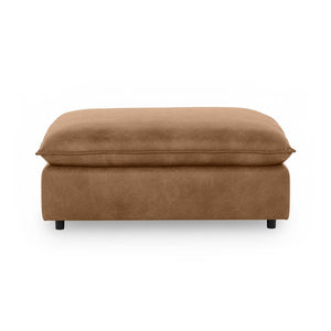 Classic Home Caplan upholstered ottoman with tufted fabric and wooden legs, designed for versatile living room use.
