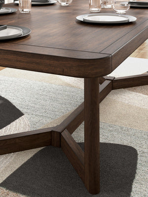 Rectangular dark brown dining room extension table by Signature Design Ashley, showcasing smooth surface and sturdy legs.