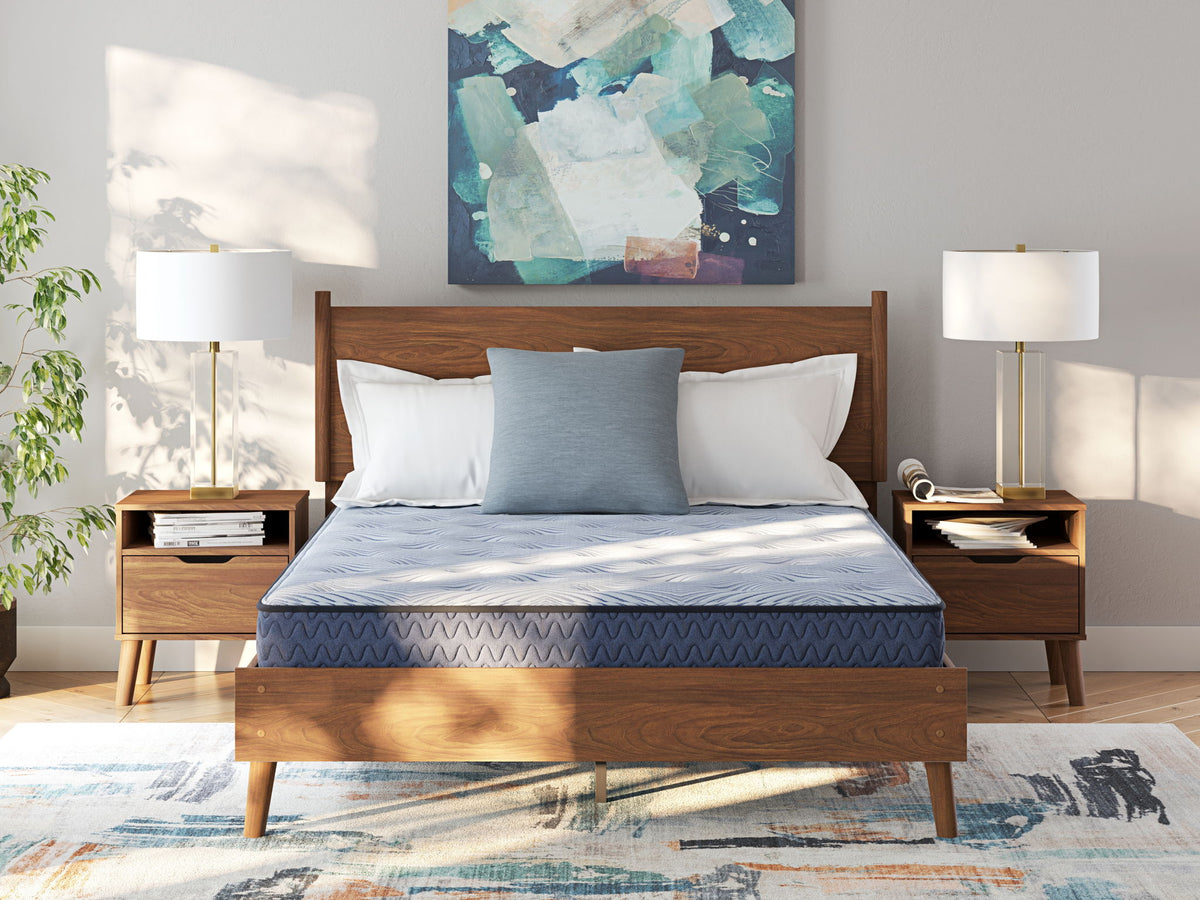 Sierra Sleep® by Ashley Peak 2.0 Bonnell hybrid mattress showing a plush, supportive surface with detailed quilting and fabric edges.