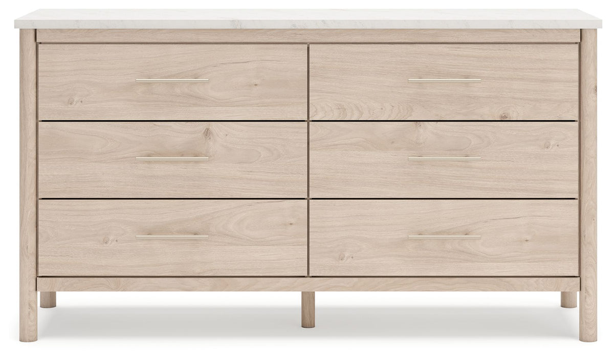 Signature Design by Ashley Cadmori six-drawer dresser with dark wood finish and sleek metal handles, detailed view of dresser drawers.