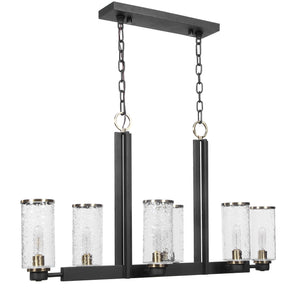 Uttermost Jarsdel 6-light industrial island pendant light in black with metal shades hanging from a ceiling mount.