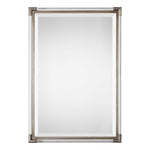 Silver metallic wall mirror by Uttermost with a sleek, round design and reflective mirror surface.