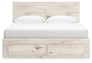 Signature Design by Ashley Lawroy panel bed with built-in storage drawers in a modern bedroom setting.