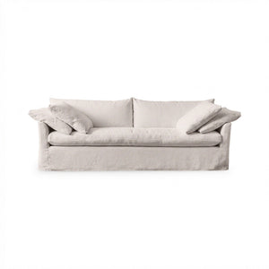 Classic Home Cassiano slip cover sofa in a cozy living room, showcasing a stylish stationary sofa with a tailored fabric cover.