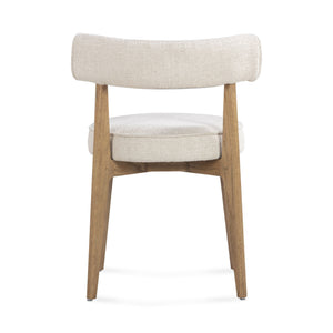 Cream fabric Nikita side dining chair by TOV Furniture with a sleek, modern design and wooden legs.