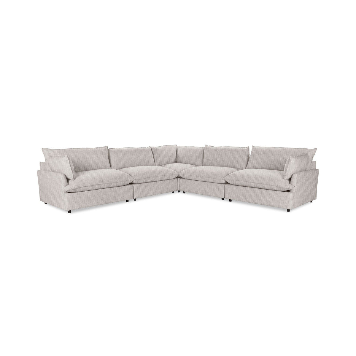 Classic Home Caplan modular sectional sofa with beige upholstery and plush cushions in a modern living room setting.