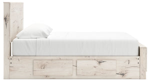 Signature Design by Ashley Lawroy panel bed with built-in storage drawers in a modern bedroom setting.