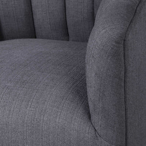 Dark gray Uttermost Cuthbert modern swivel chair with a sleek design and comfortable cushioned seat.