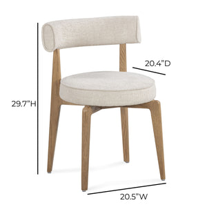 Cream fabric Nikita side dining chair by TOV Furniture featuring a sleek, modern design with a cushioned seat and wooden legs.