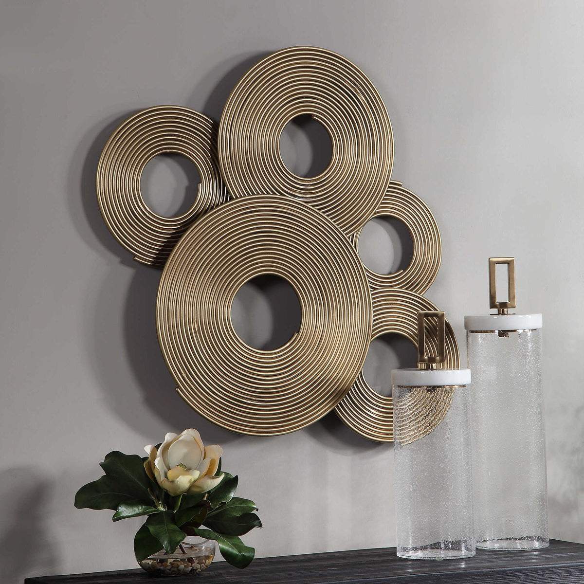 Uttermost Ahmet gold rings wall decor with overlapping circular metal accents for modern interior design.