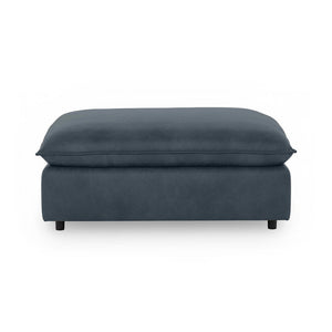Classic Home Caplan upholstered ottoman with soft fabric and cushioned top, ideal as a versatile living room accent piece.