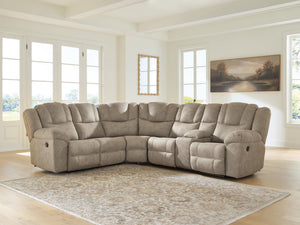 Signature Design by Ashley Pearce-Pike reclining sectional sofa with plush cushions and modern design, shown in a cozy living room setting.