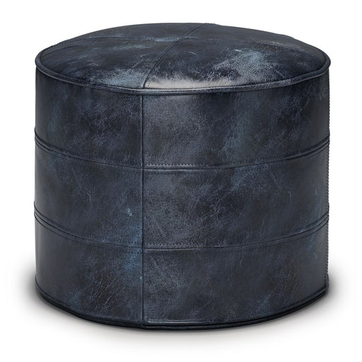 Simpli-Home Connor handcrafted round accent pouf with textured fabric, suitable as a stylish floor seat or footrest.
