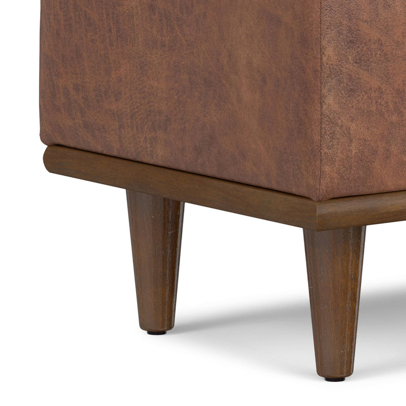 Small Simpli-Home Shiloh storage ottoman with fabric upholstery and built-in storage space for living room organization.