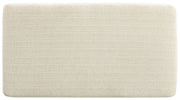 Upholstered Maggie ottoman by Signature Design by Ashley, featuring a soft fabric surface and sturdy wooden legs.