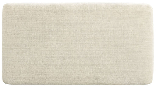 Upholstered Maggie ottoman by Signature Design by Ashley, featuring a soft fabric surface and sturdy wooden legs.