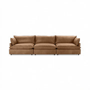 Modern Caplan stationary sectional sofa by Classic Home with plush cushions and sleek design in a contemporary living room setting.