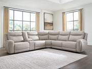 Benchcraft® Gravier reclining sectional sofa with plush cushions and reclining features, shown in a modern living room setting.