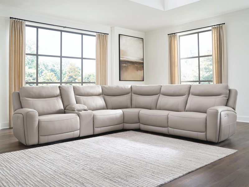 Benchcraft® Gravier reclining sectional sofa with plush cushions and reclining features, shown in a modern living room setting.