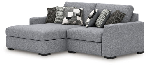 Benchcraft Bealton stationary sectional sofa with plush fabric cushions and modern design, shown in a cozy living room setting.