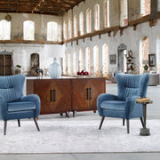 Uttermost Dax mid-century blue accent chair with curved wooden legs and plush upholstered seat and back for stylish comfort.