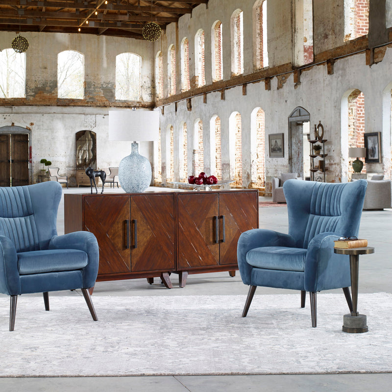 Uttermost Dax mid-century blue accent chair with curved wooden legs and plush upholstered seat and back for stylish comfort.