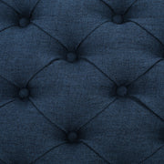 Noble House Guernsey storage ottoman with tufted top and fabric upholstery, serving as a stylish and functional storage solution.